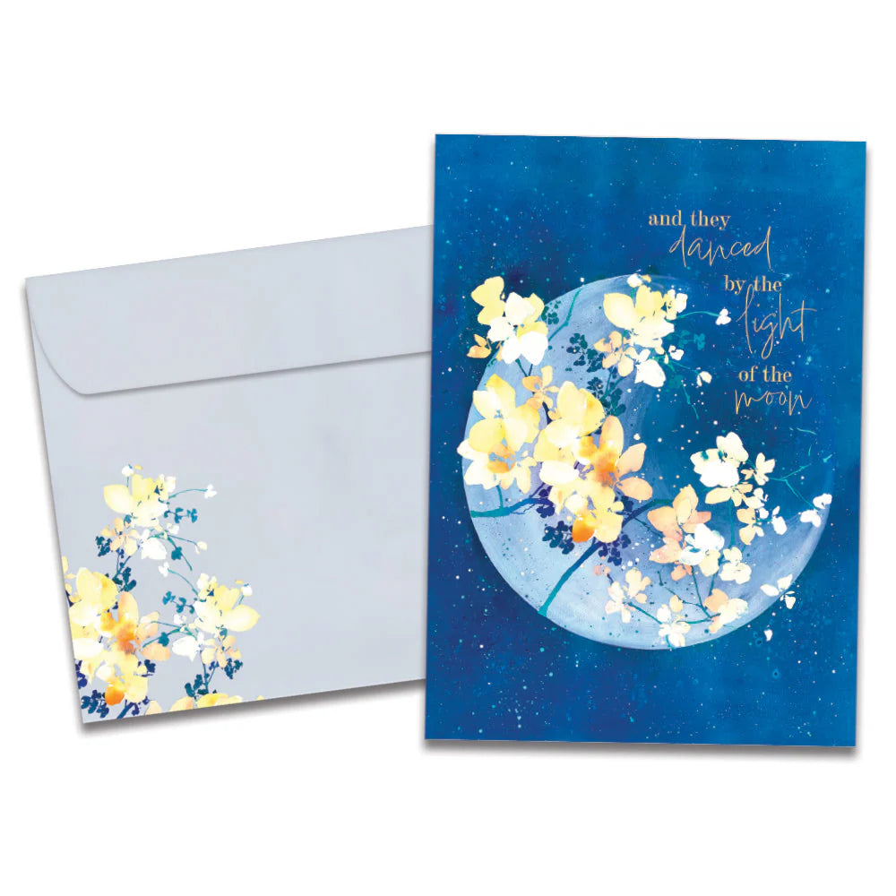 blue card with moon and flowers with words saying and they danced by the light of the moon