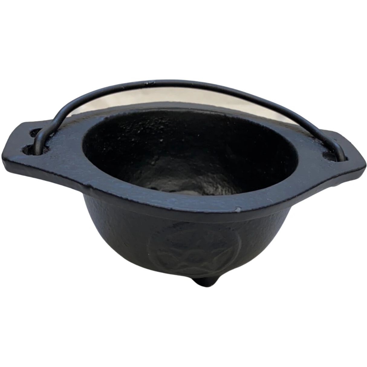 Small black cast iron cauldron with a pentagram design and a metal handle.