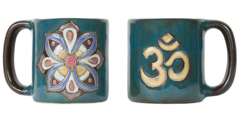 Teal blue mug with an OM symbol on one side and a mosaic flower of life on other