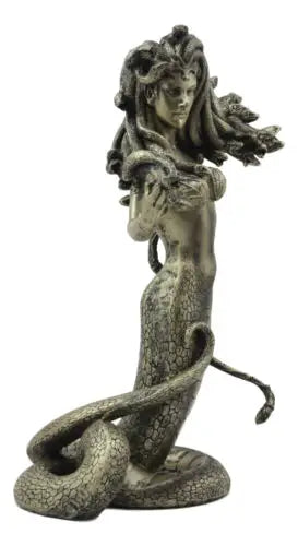 Statue of a woman with a snake on a white background