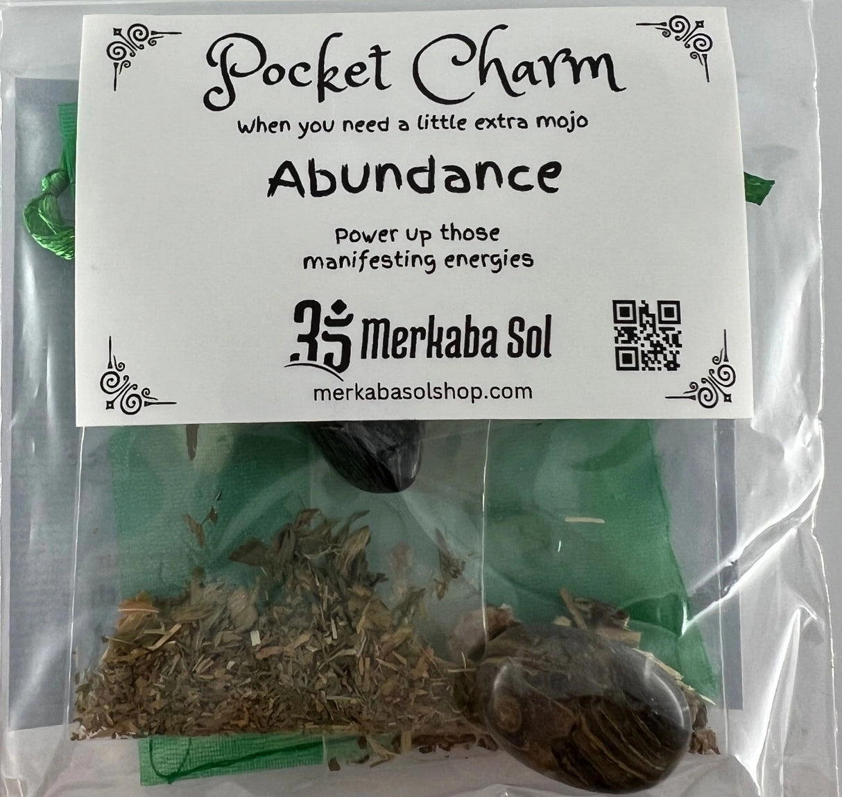 Abundance Pocket Charm Kit with Transparent packaging, White label, and Black text.