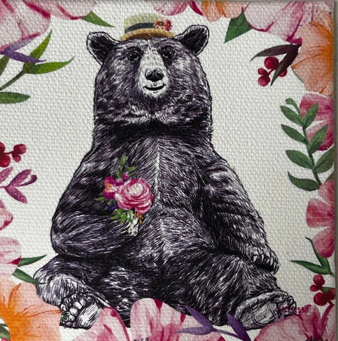 Bear Canvas Magnet with a black bear wearing a hat and holding a bouquet of flowers, surrounded by floral patterns.