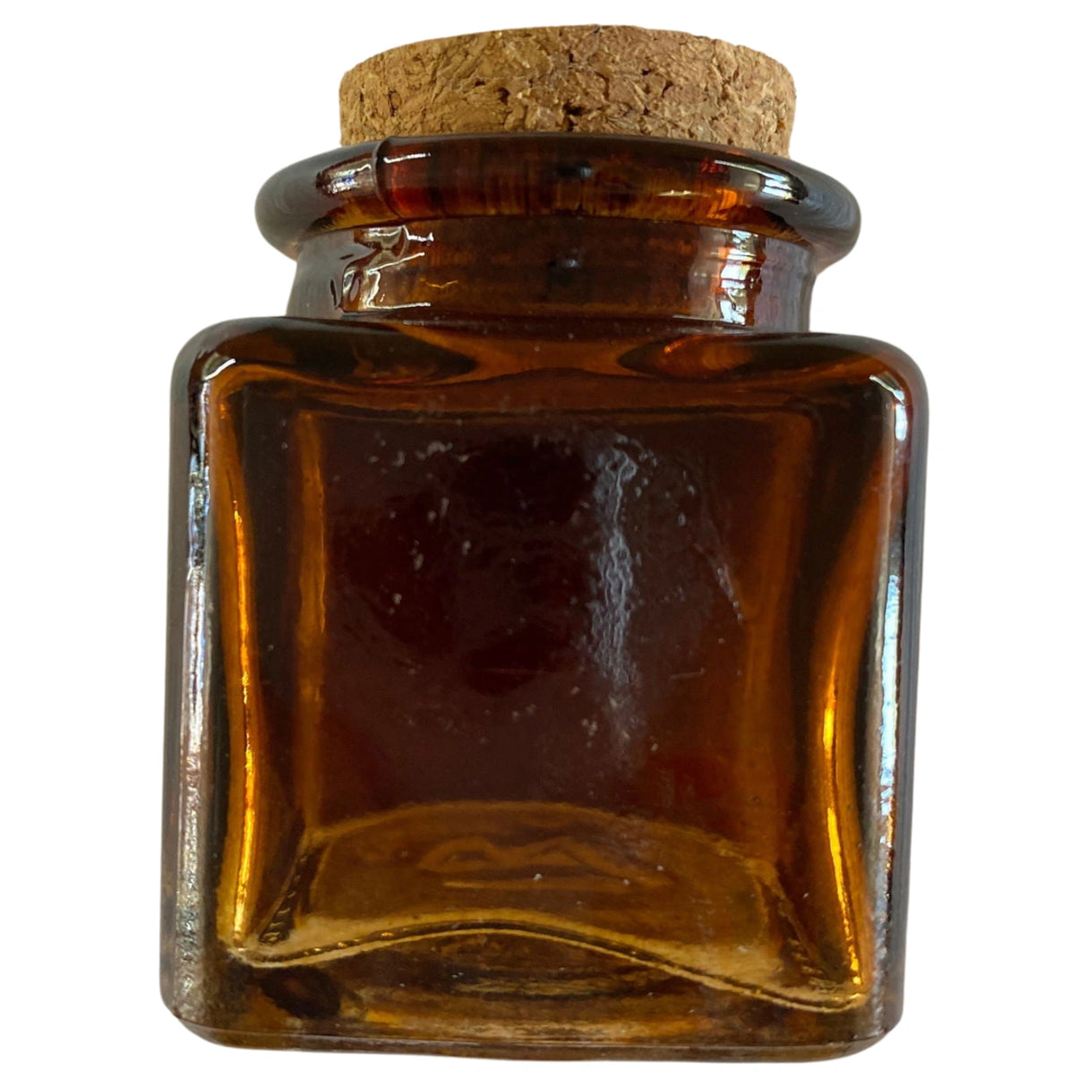 Amber glass jar with a cork stopper.