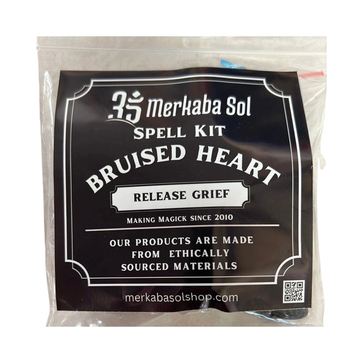 Bruised Heart Spell Kit with Transparent packaging, Black Label, and white text.