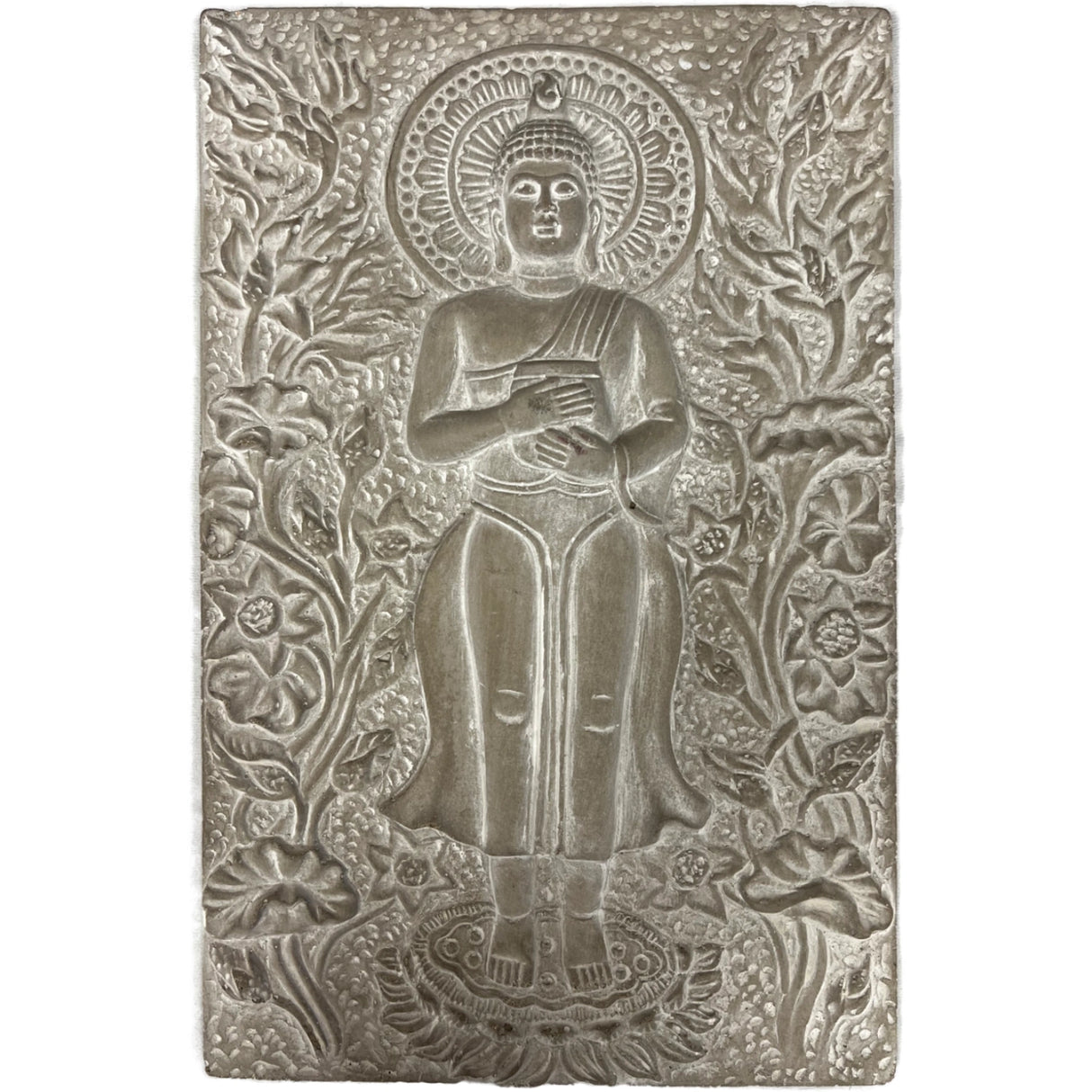 Gray stone wall plaque with a carved Buddha figure surrounded by floral designs.