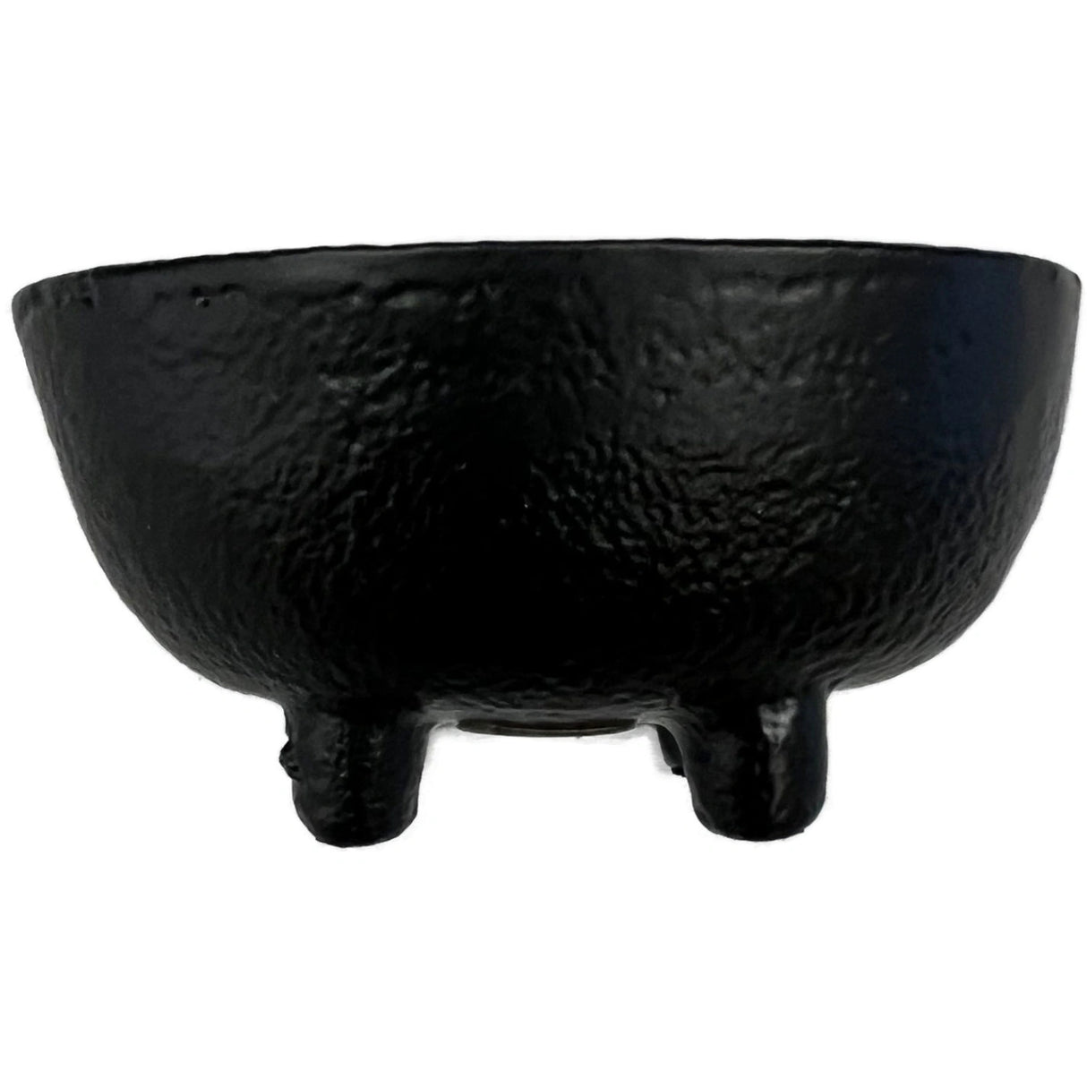 Small black cast iron incense burner with three legs.
