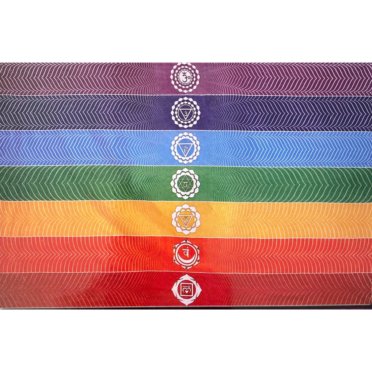 Chakra tapestry with seven horizontal stripes in the colors of the rainbow, each with a chakra symbol.