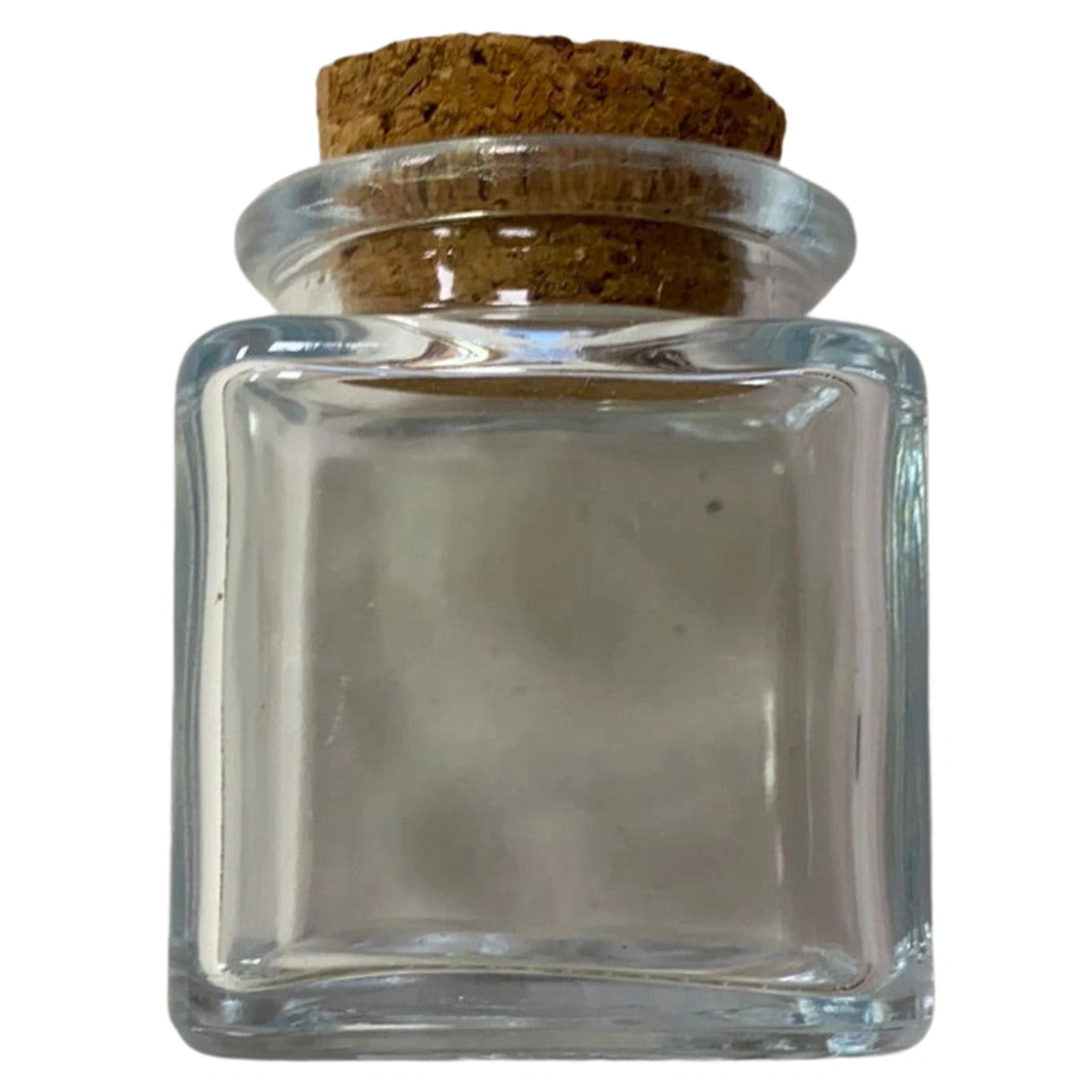 Small square glass jar with a cork stopper.