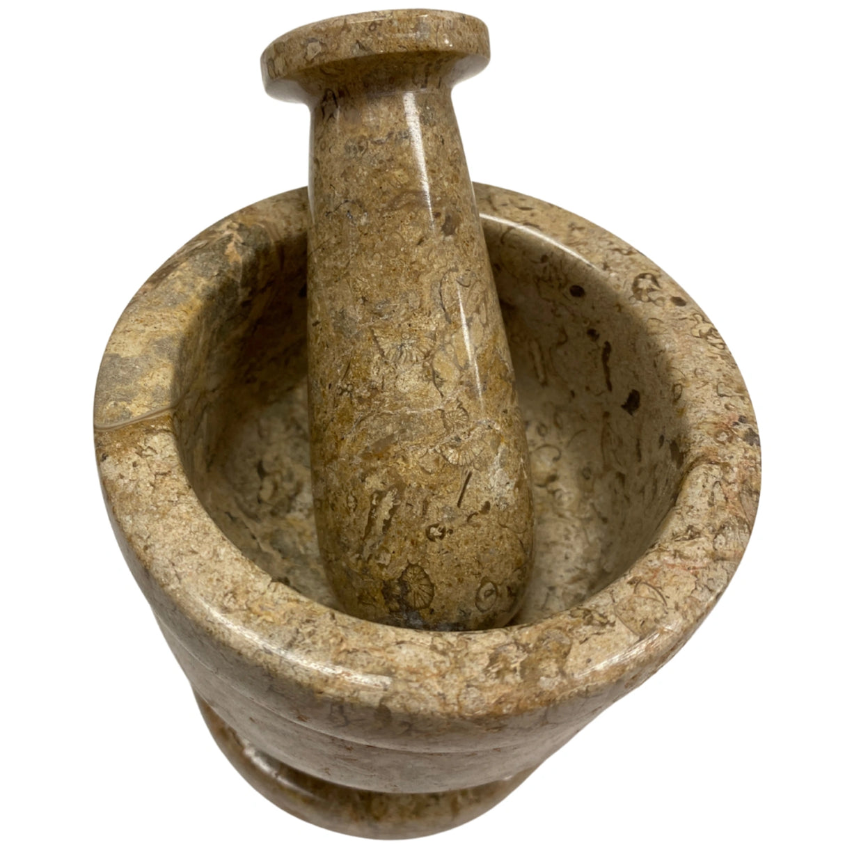 Brown marble mortar and pestle set with fossilized coral inclusions.