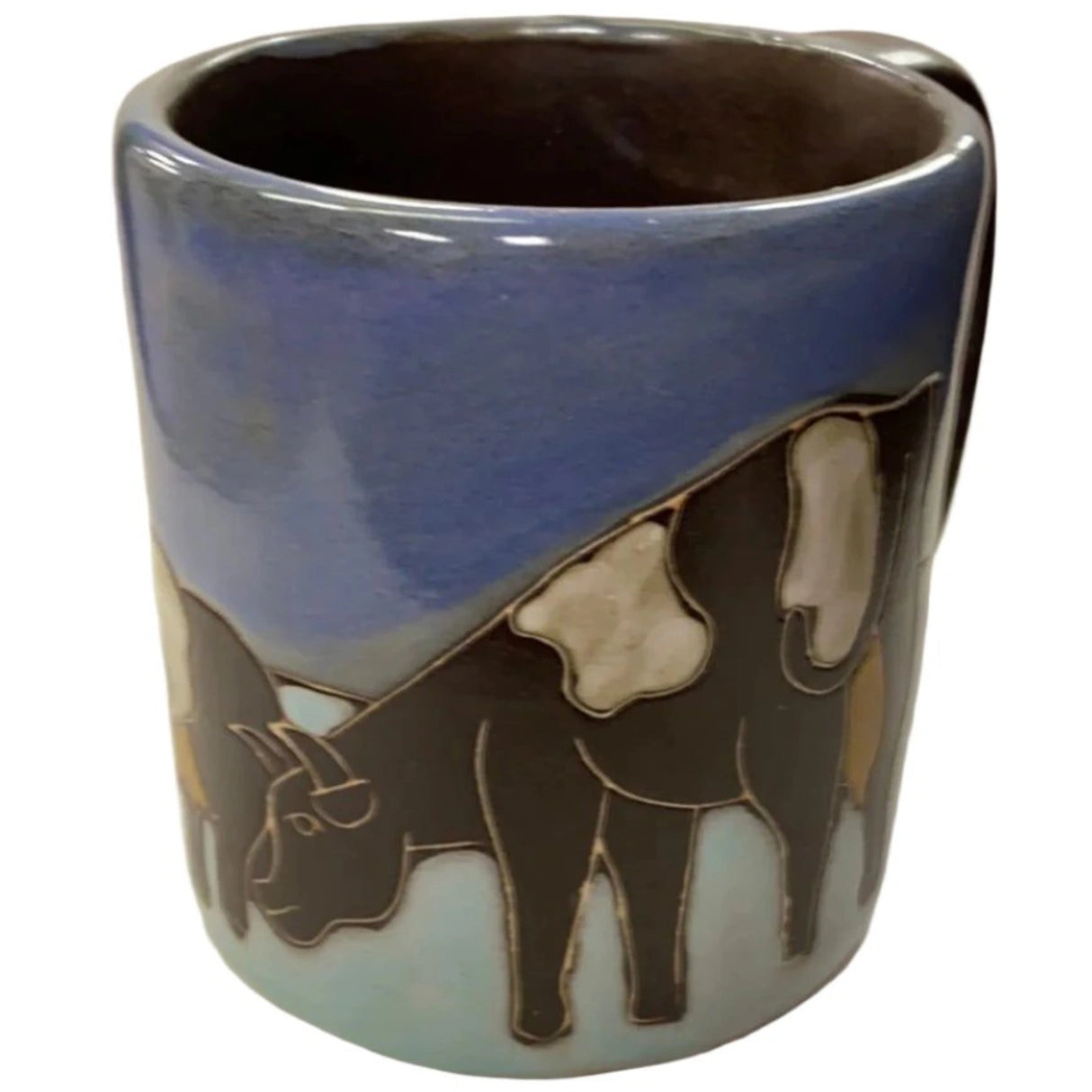Stoneware mug with cow design.
