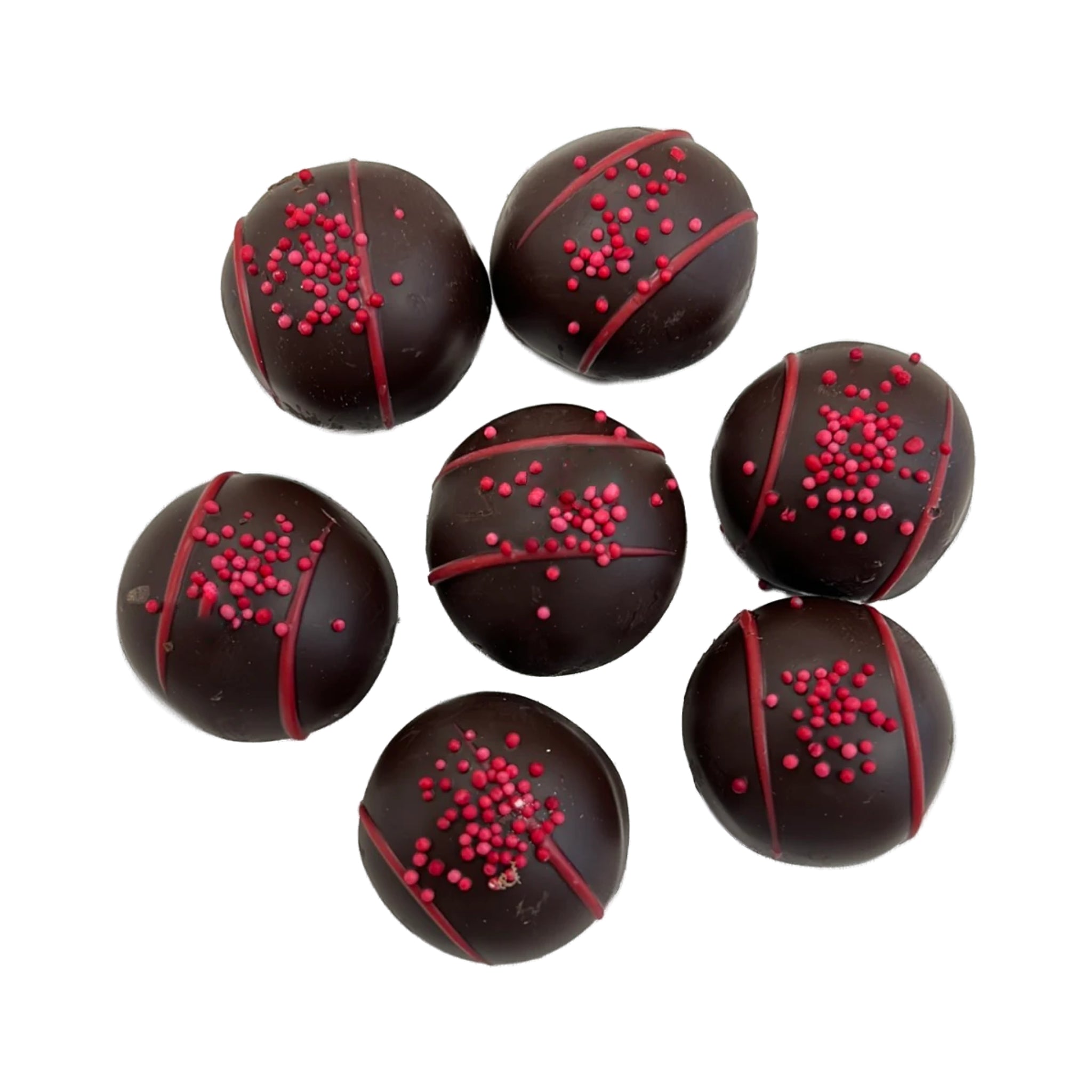 Large round marble size dark chocolate  balls with red sprinkles and red lace icing 