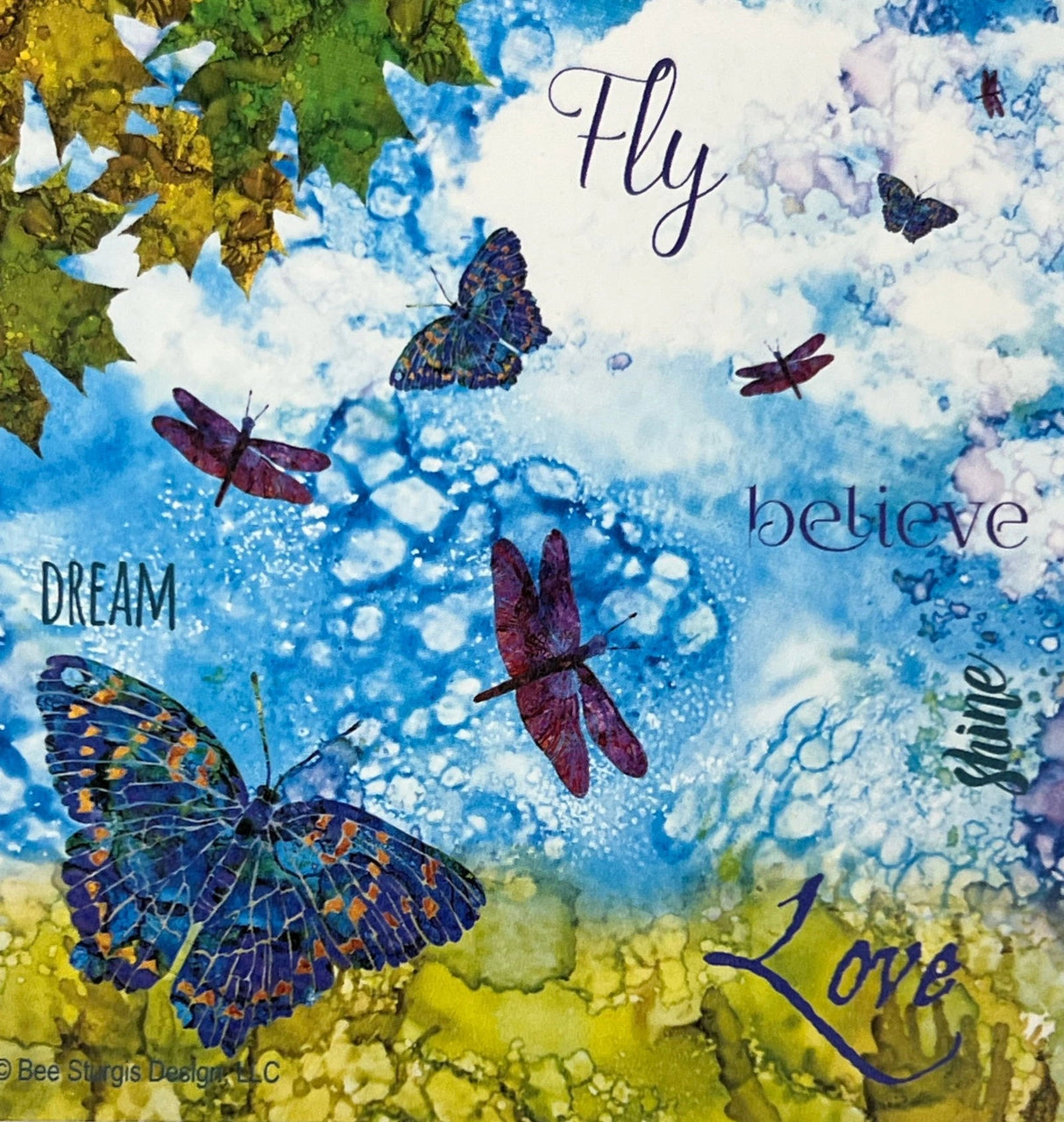 Dragonfly Dreams magnet with colorful butterflies and dragonflies flying in a blue sky, with the words "Fly", "Believe", "Dream", and "Love" written in the corners.