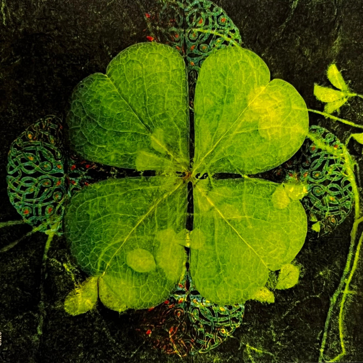 Four Leaf Clover Canvas Magnet with a four-leaf clover in the center, surrounded by intricate, colorful patterns and a dark background.