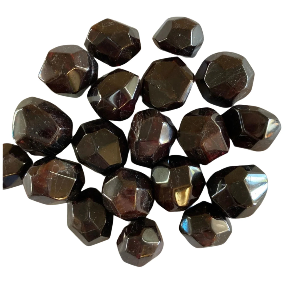 Tumbled garnet stones with a smooth, polished finish and a deep red color.