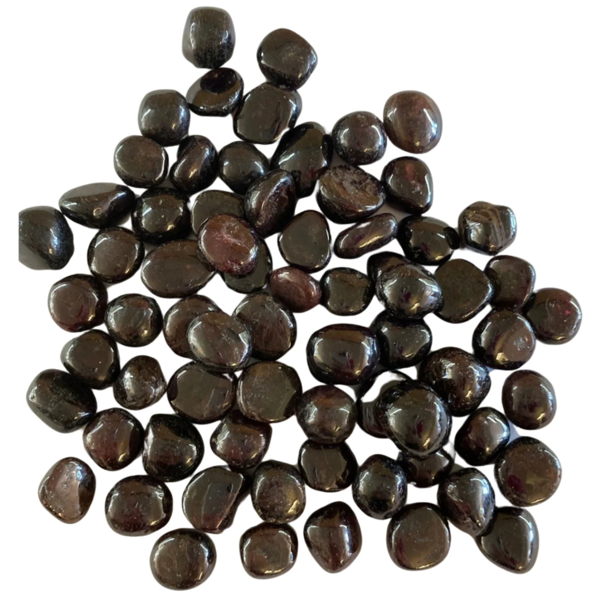 Tumbled garnet stones in various shades of red, with some exhibiting a slightly translucent quality.