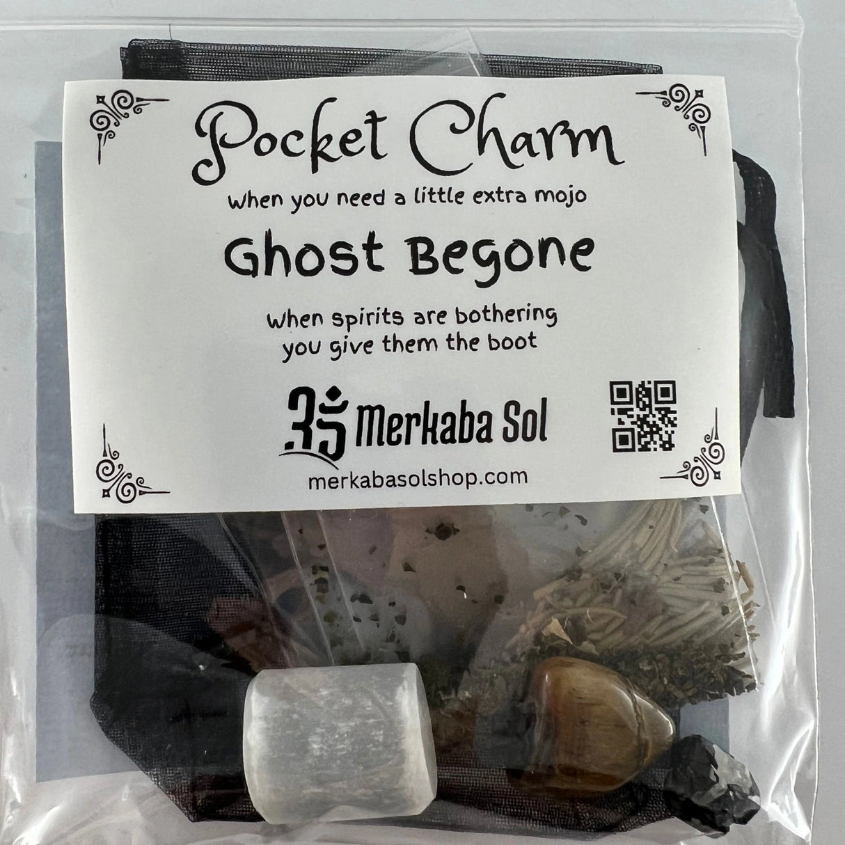 Ghost Begone Pocket Charm Kit with Transparent packaging, White label, and Black text.