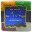 Gifts of the Magi Candle Set with gold, green, red, and white candles.