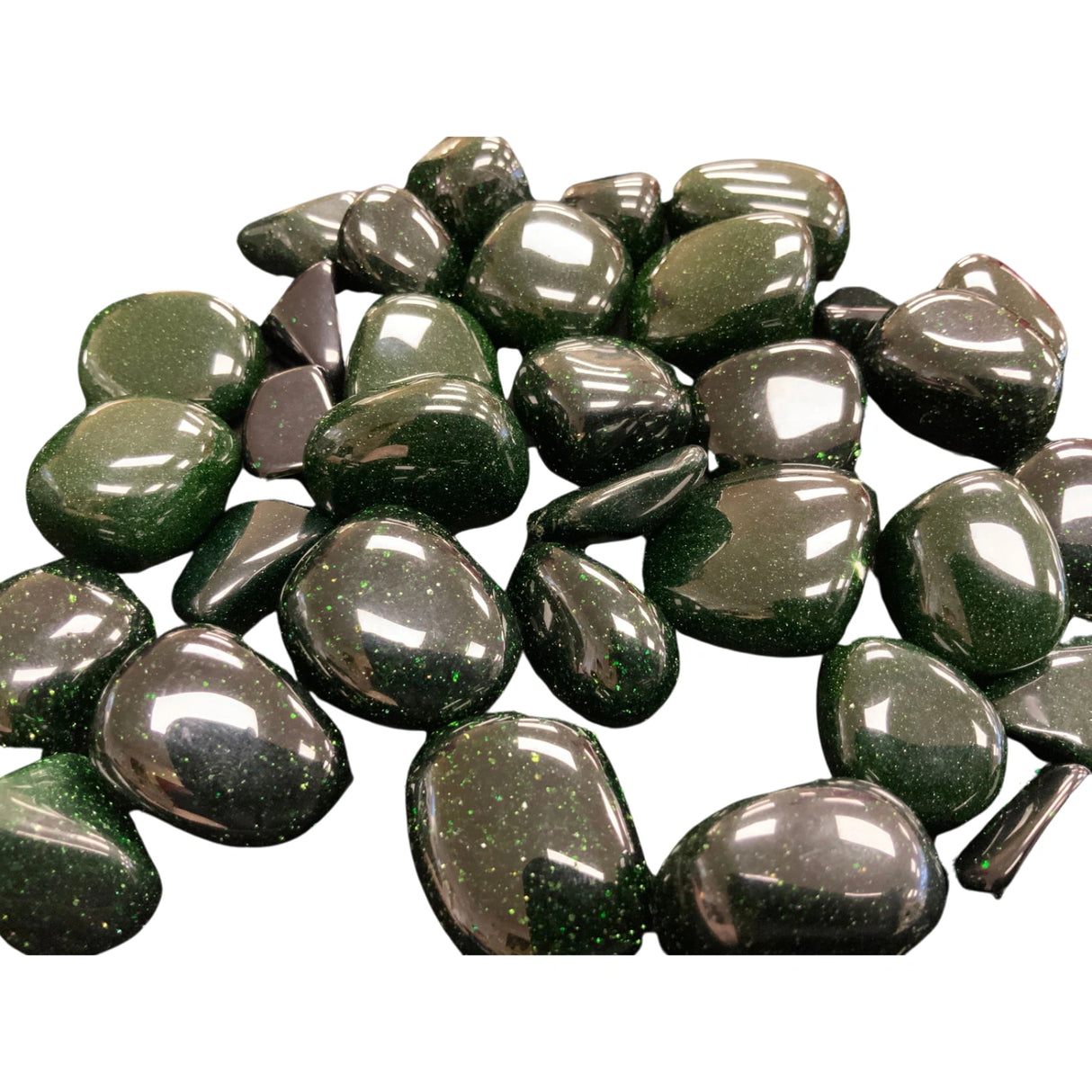 Tumbled Green Goldstone stones with a smooth, polished finish and a deep green color with shimmering golden inclusions.