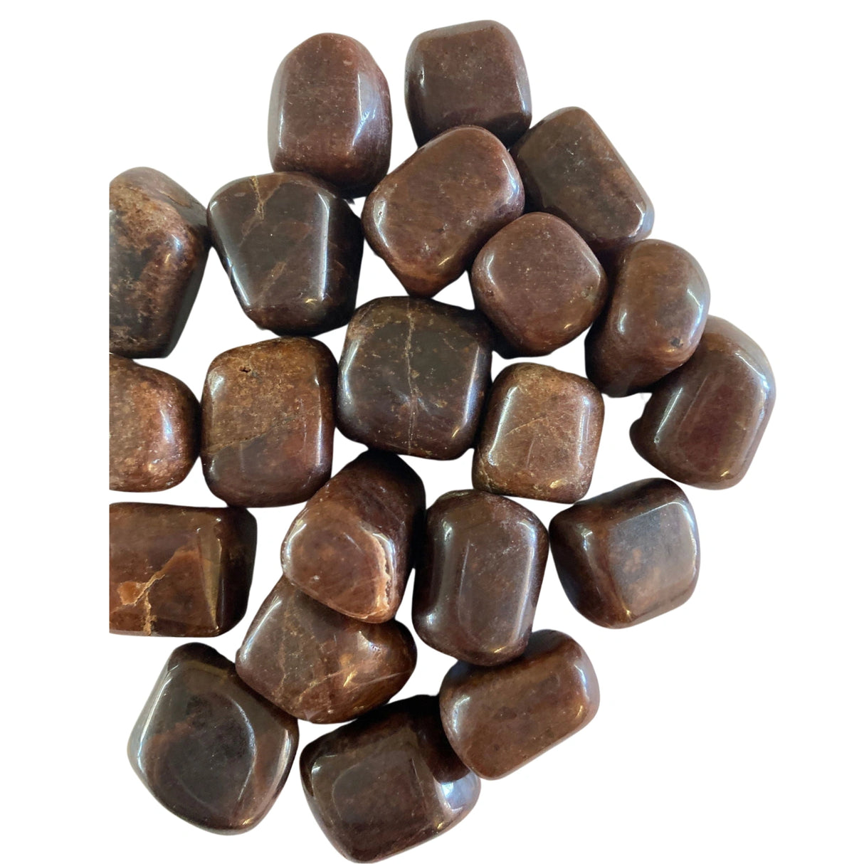 Tumbled Hessonite Garnet stones with a smooth, polished finish and a rich, deep orange-brown color.