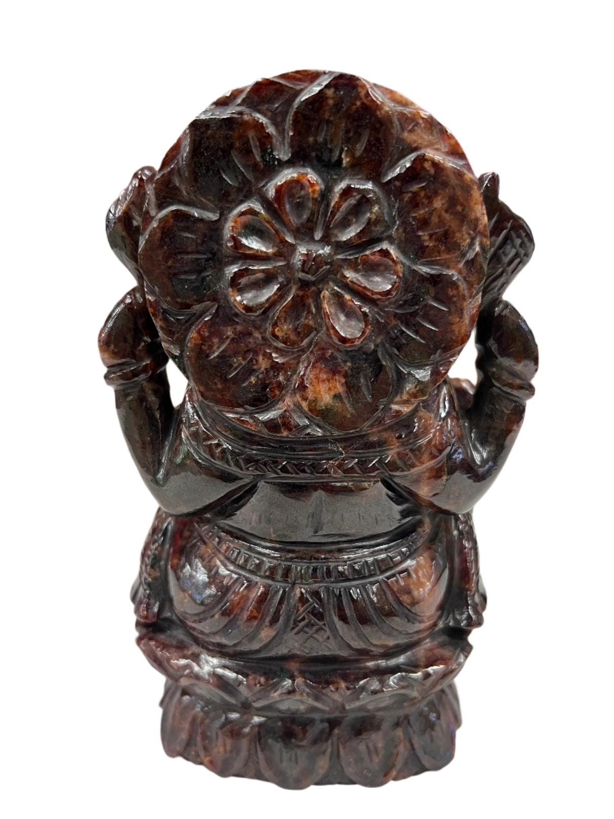 back of red statue showing a lotus flower