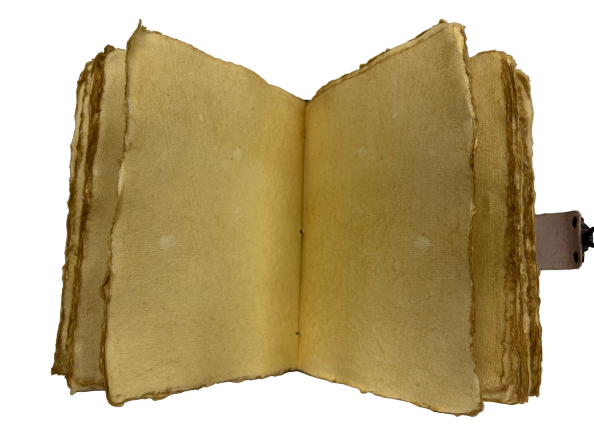 Open book with yellowed pages of hand made paper