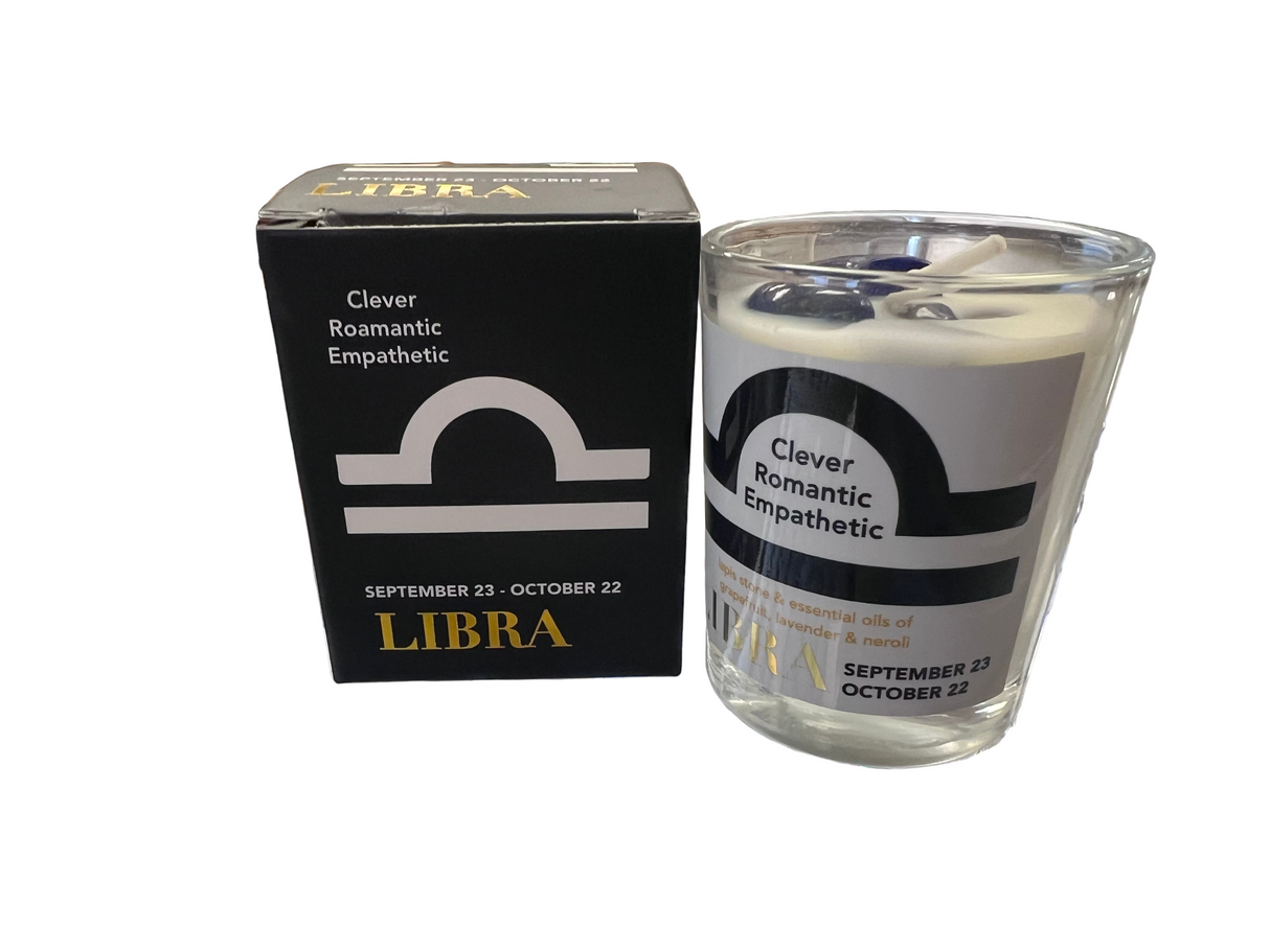 Libra Votive small white votive candle with lettering on label