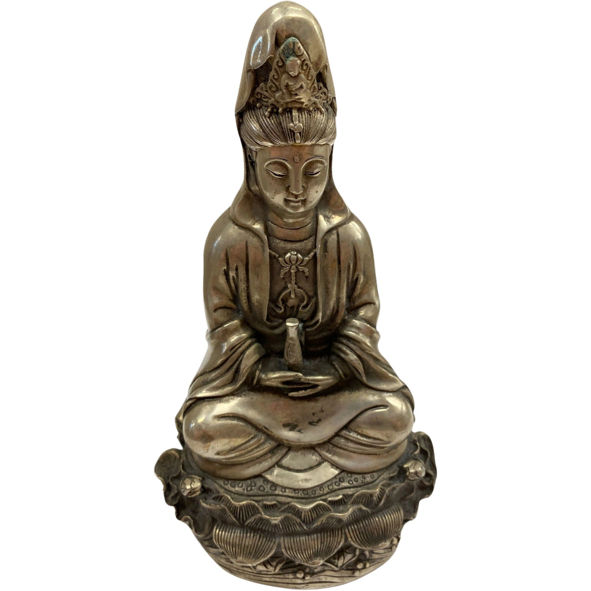 Silver Guanyin statue seated on a lotus base, holding an object in her hands. She wears a headdress adorned with jewels.