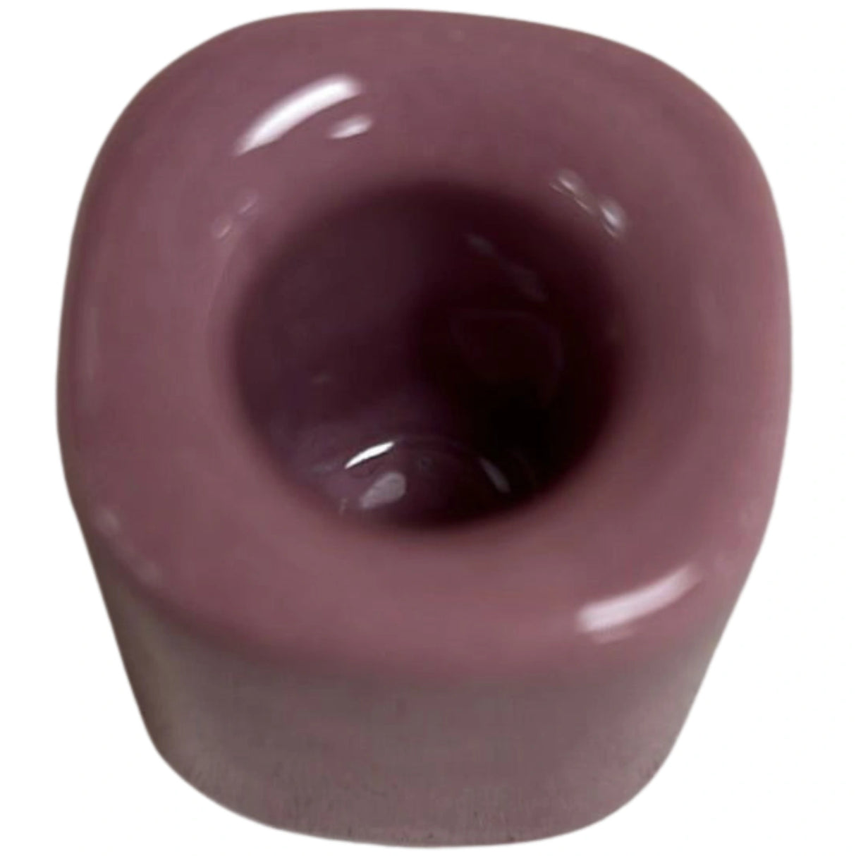 Lavender ceramic candle holder with square base and round top.