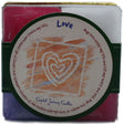 Love Candle Set with pink, purple, green, and white candles.