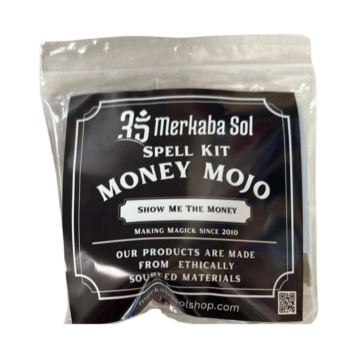Money Mojo Spell Kit with Transparent packaging, Black Label, and white text.