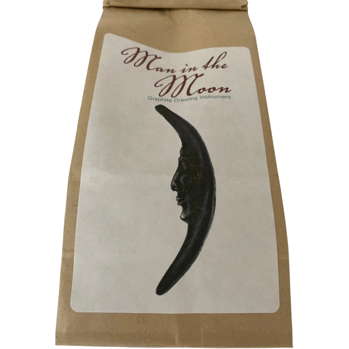 Man in the Moon Graphite Drawing Instrument in brown paper bag.