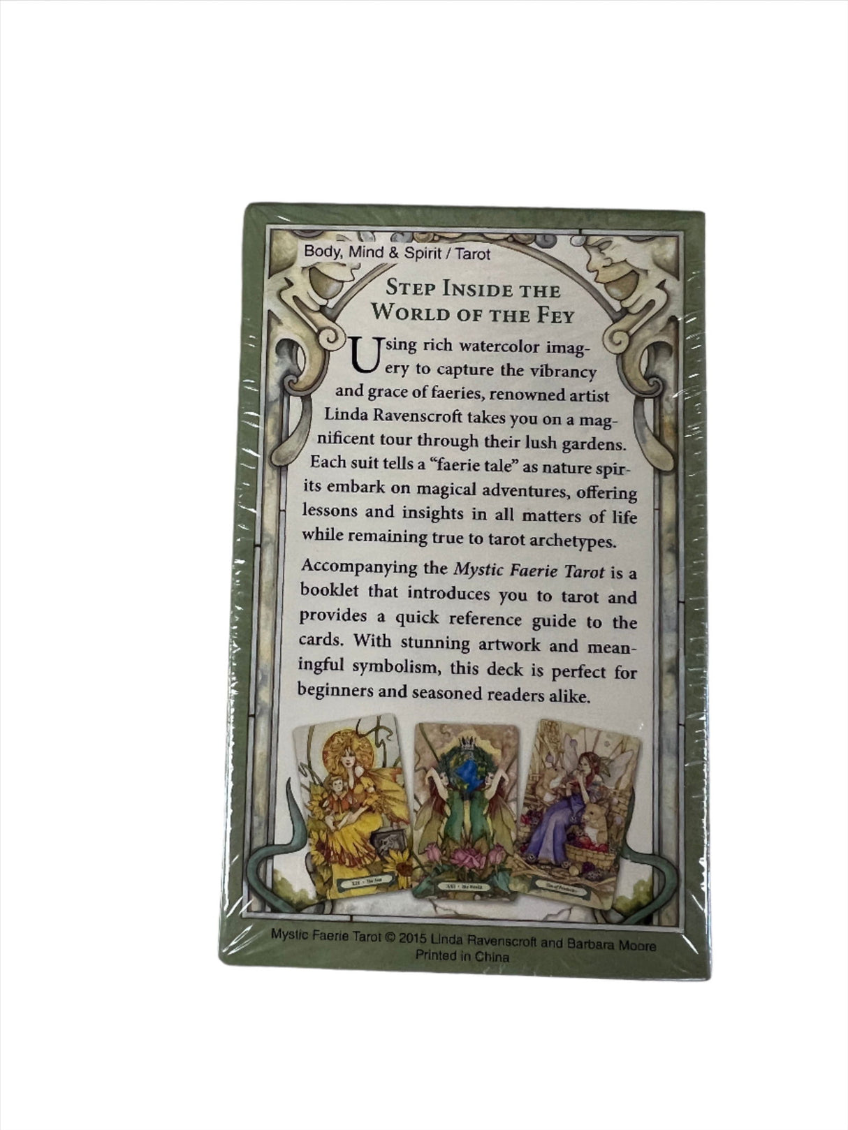 Mystic Faerie Tarot - back of olive green box with 3 images of cards and a description