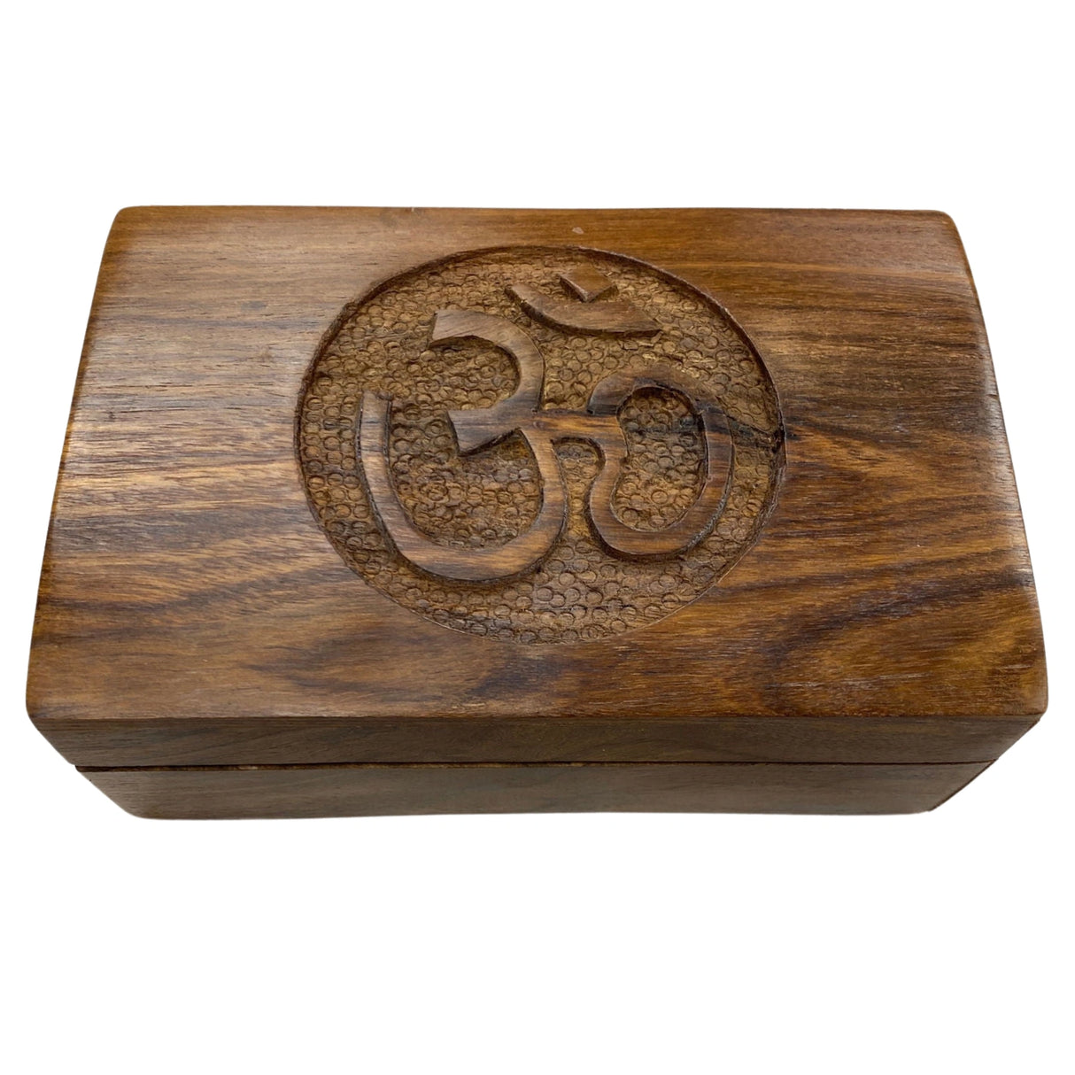 Wooden box with carved Om symbol.