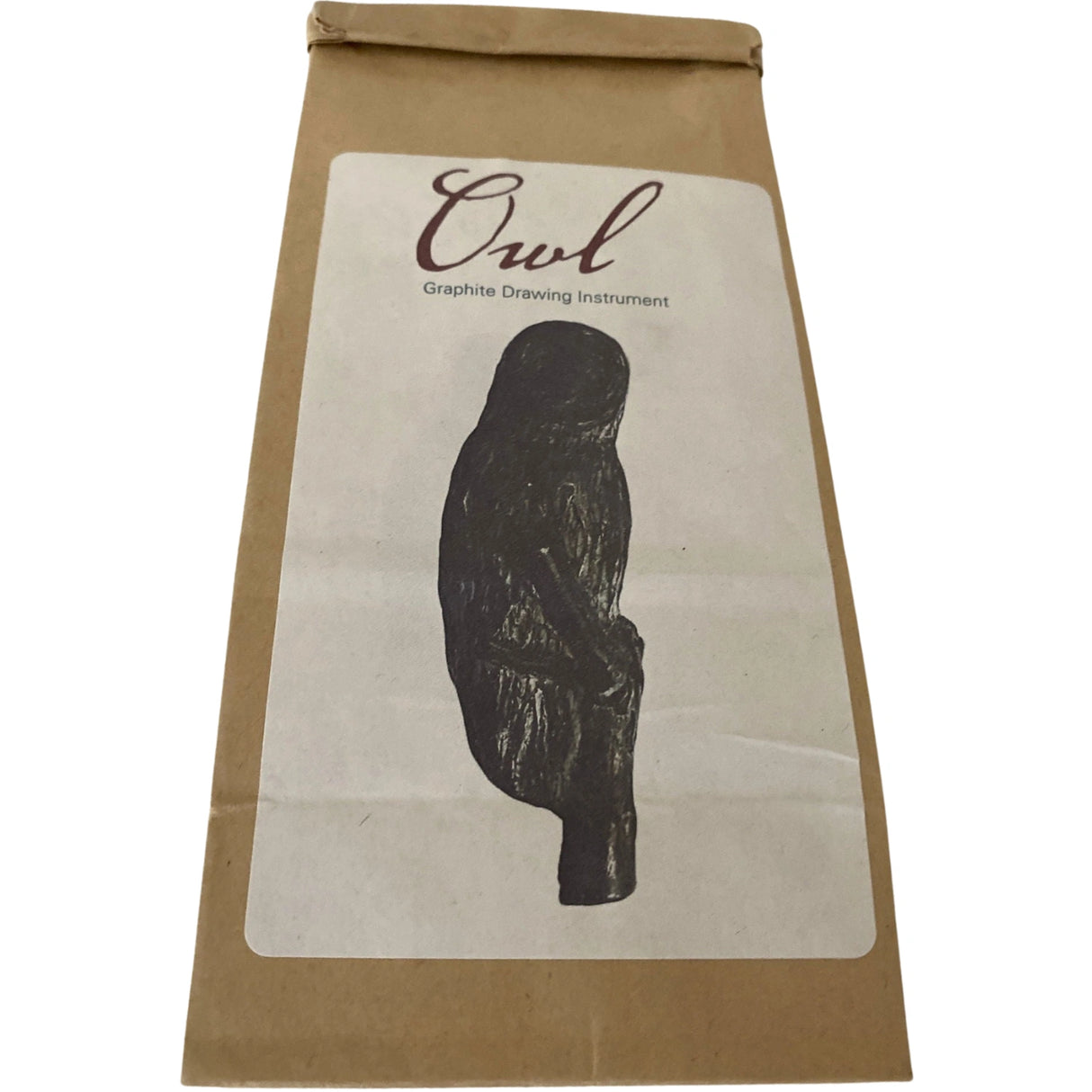 Owl Graphite Drawing Instrument in brown paper bag.