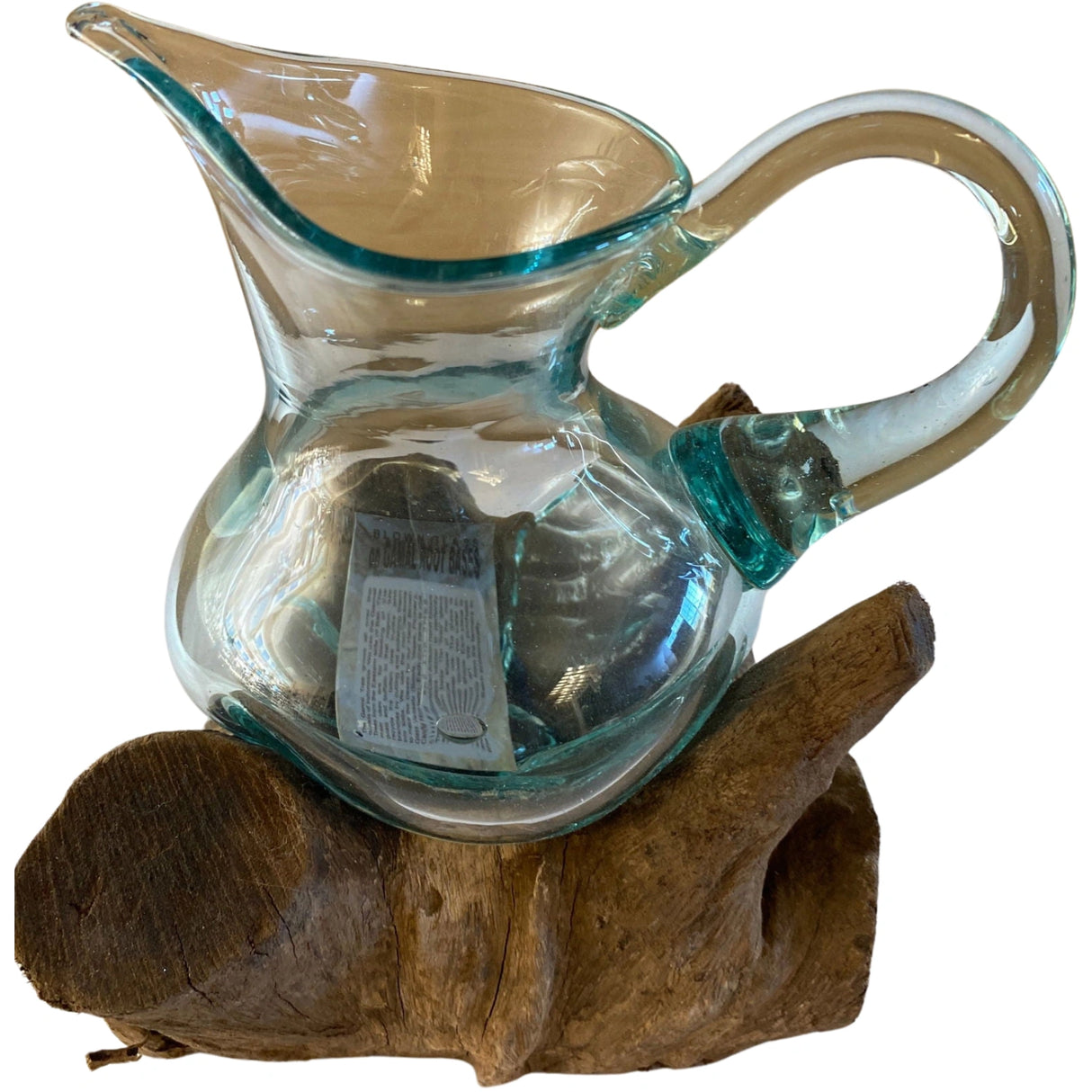 Molten glass pitcher on driftwood base.