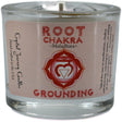 Red votive candle with the words "ROOT CHAKRA," "MULADHARA," and "GROUNDING" printed on it. The candle is surrounded by a white label with additional information about its use for meditation and chakra balancing.