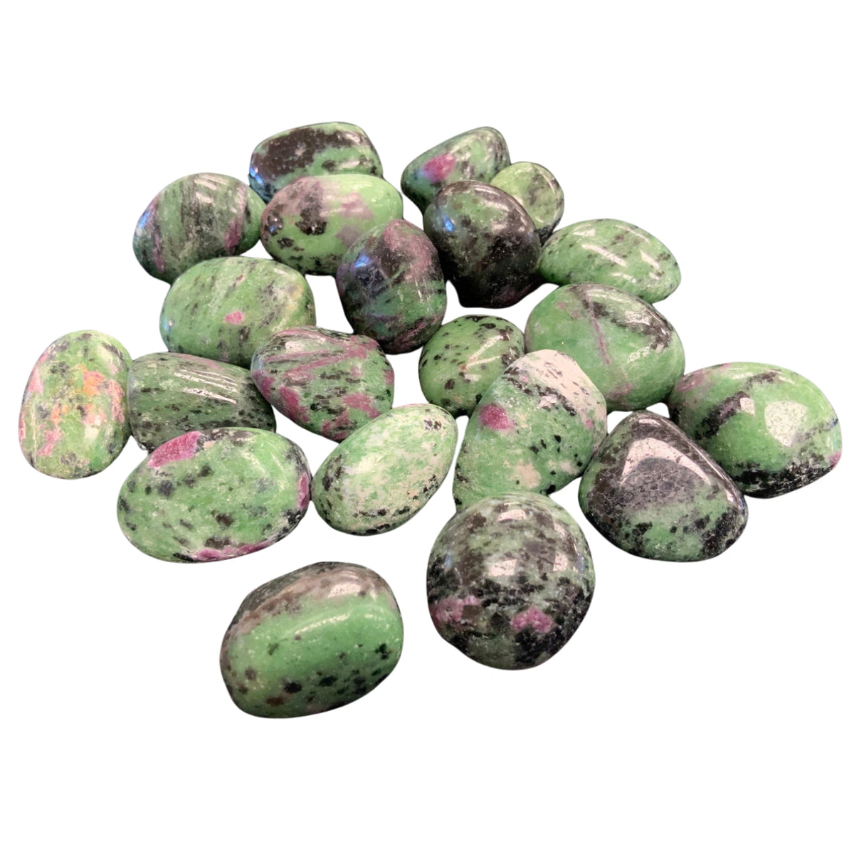 Ruby Zoisite Tumbled - Polished stones with green and pink hues and black flecks.
