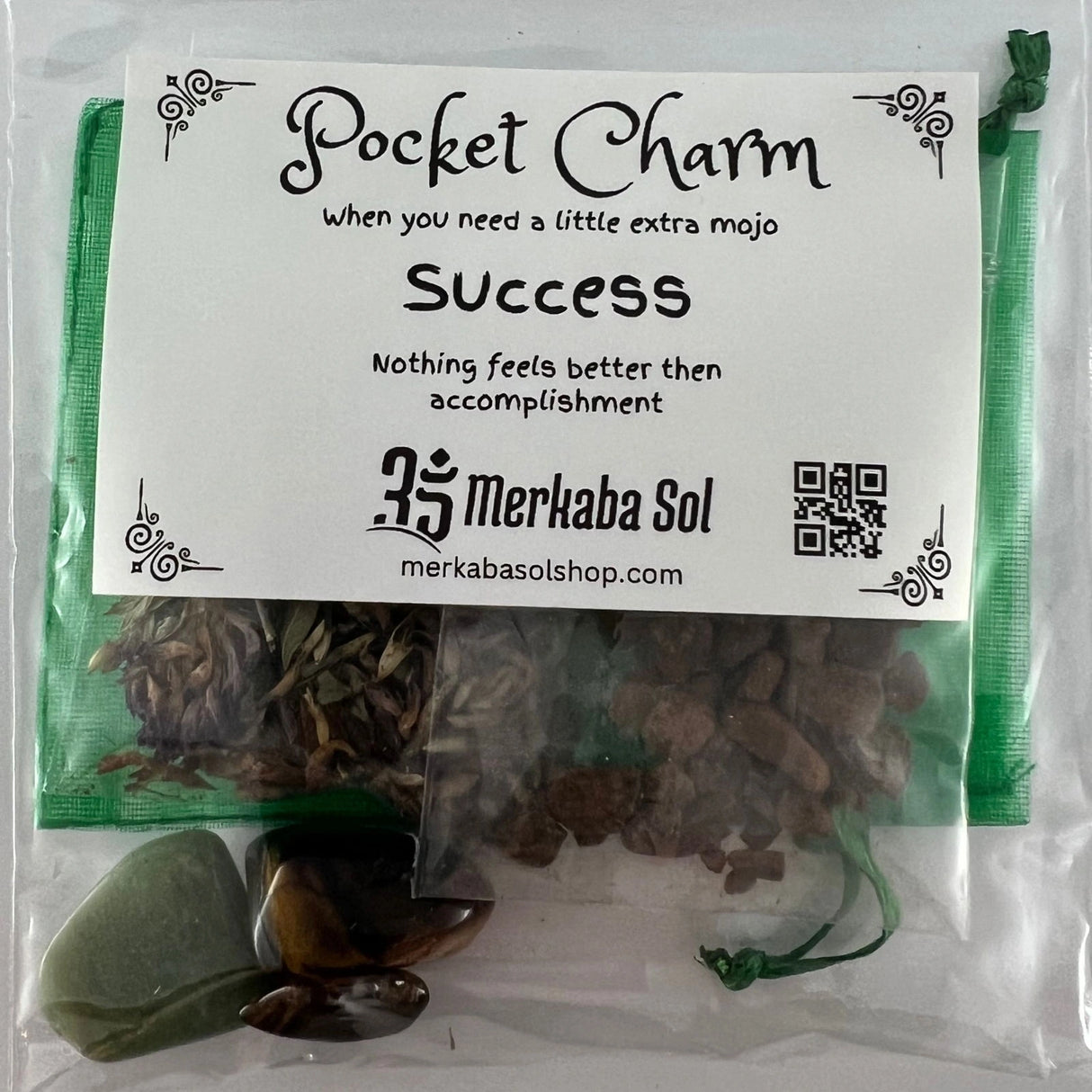 Success Pocket Charm Kit with Transparent packaging, White label, and Black text.