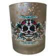 Glass votive candle holder with a silver metallic finish and a Day of the Dead sugar skull design.