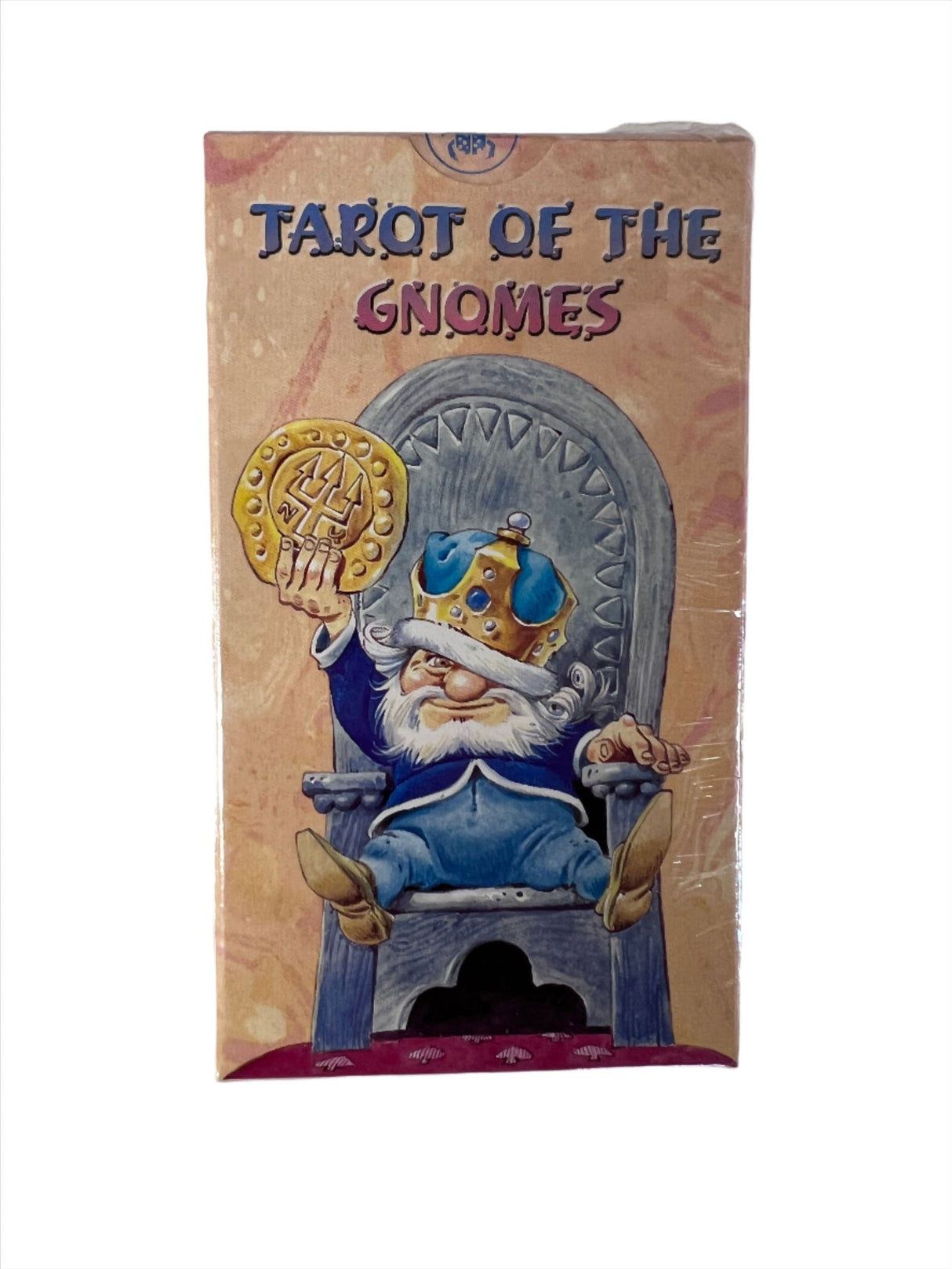 Tarot of the Gnomes - Beige colors card box with an image of a gnome sitting in a chair . Tile of Tarot of Gnomes