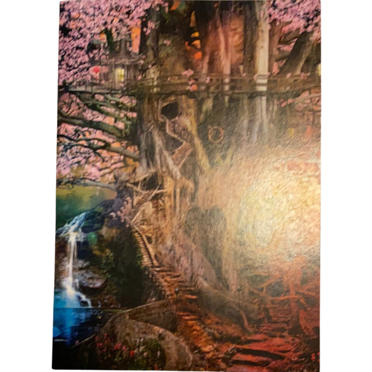 A fantastical tree with a house built into its trunk, surrounded by blooming pink flowers and a cascading waterfall.