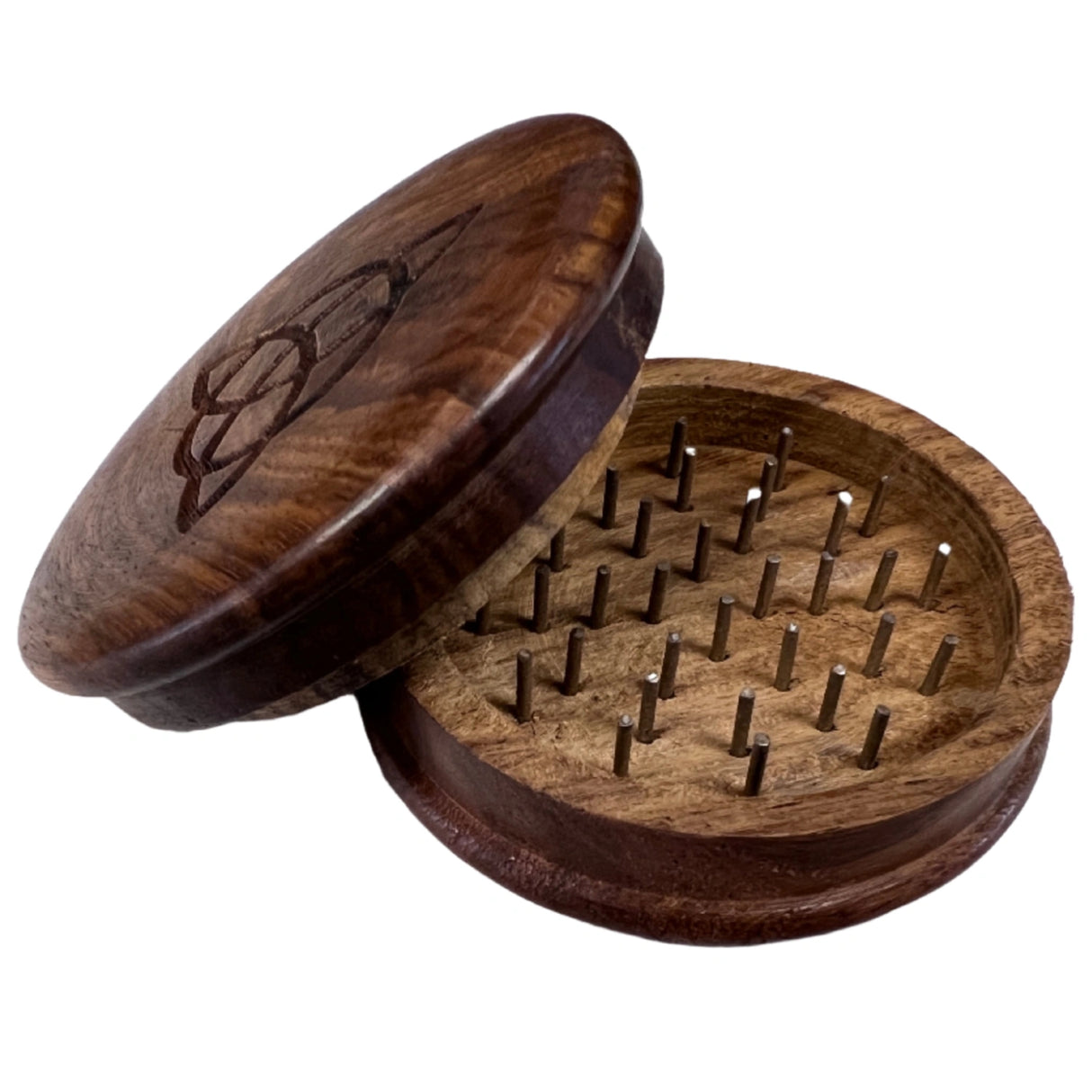 Wooden herb grinder with triquetra symbol.