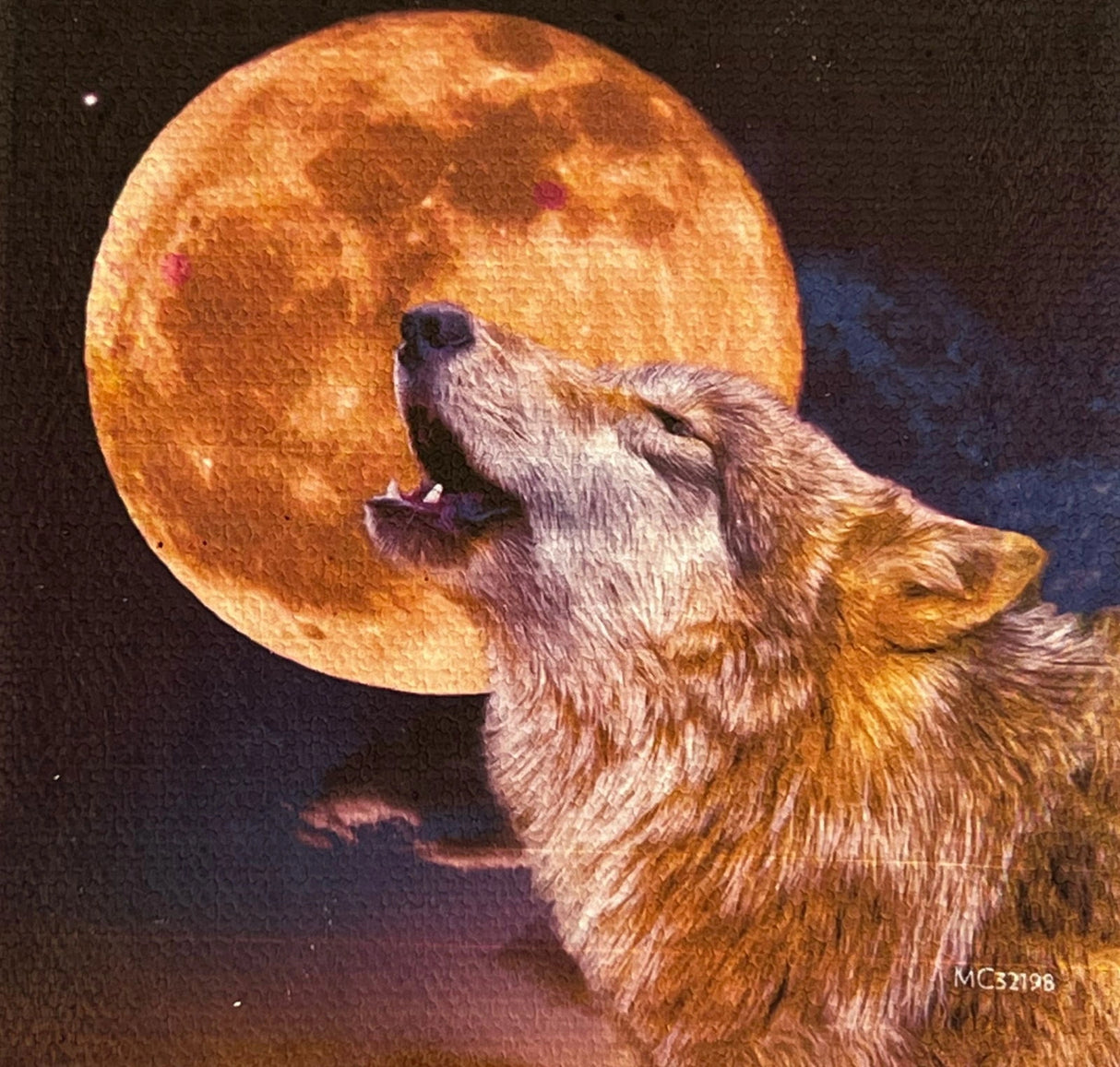 Wolf Moon canvas magnet with a wolf howling at a large, orange moon.