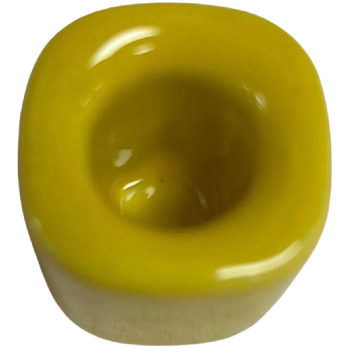 Yellow ceramic candle holder.