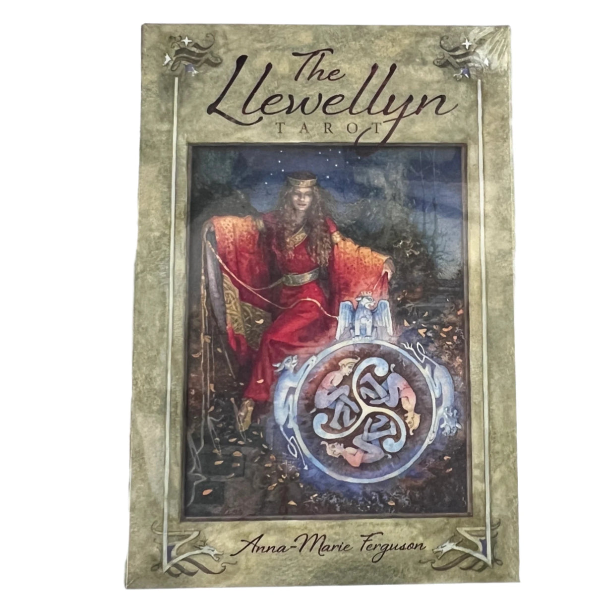 Llewellyn tarot with grey green cover and image of woman sitting