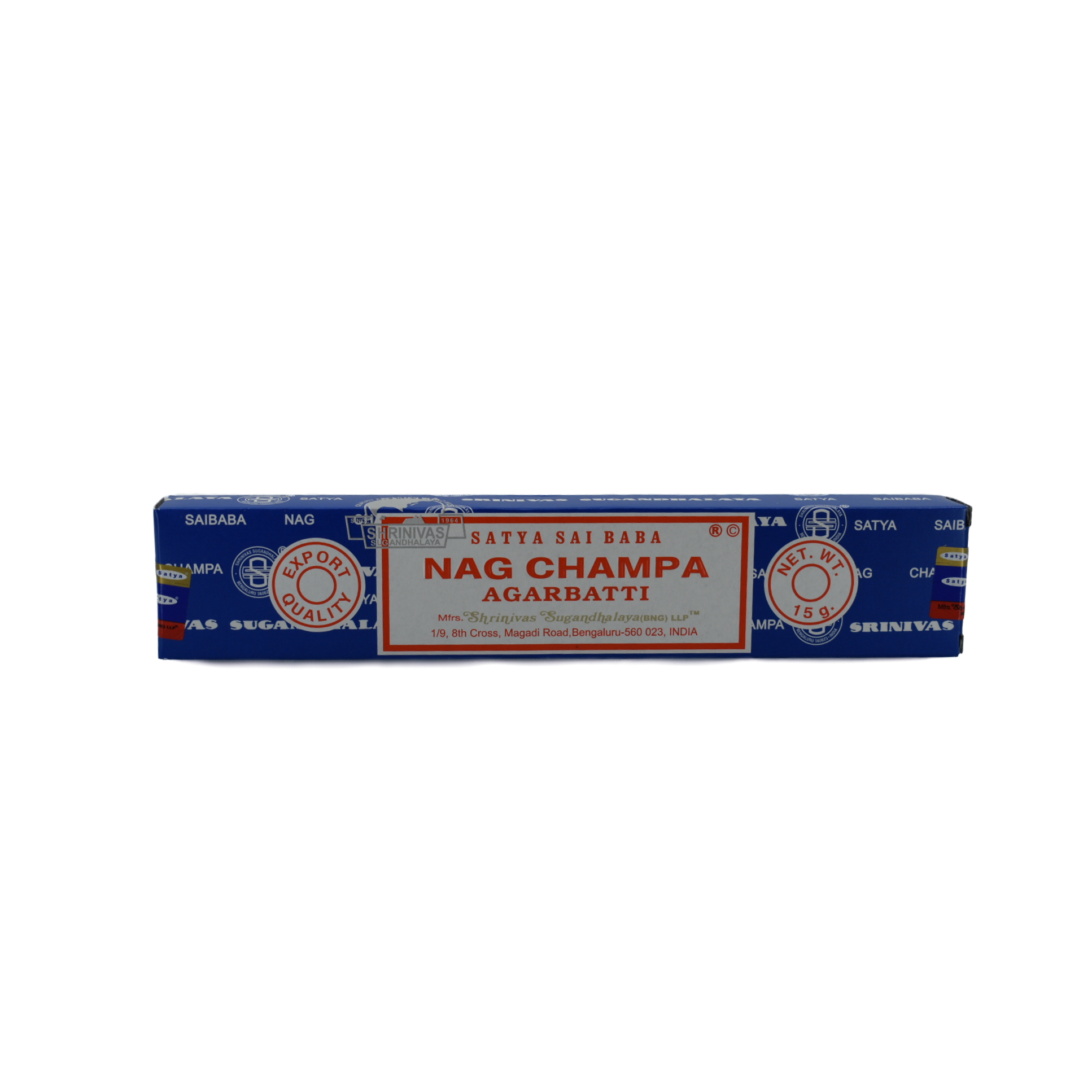 Nag Champa 15gr Sai Baba Incense Sticks. A dark blue box with a white rectangle in the middle. The red lettering and frame just inside the border. The lettering has the company name and title; Satya Sai Baba, Nag Champa, Agarbatti. Below the title is the manufacturer's information listed. In the lower right corner of the rectangle is the certified green product emblem. There are two circles, one on each side of the rectangle. The left circle says Export Quality and the right circle says Net Weight 15 grams.