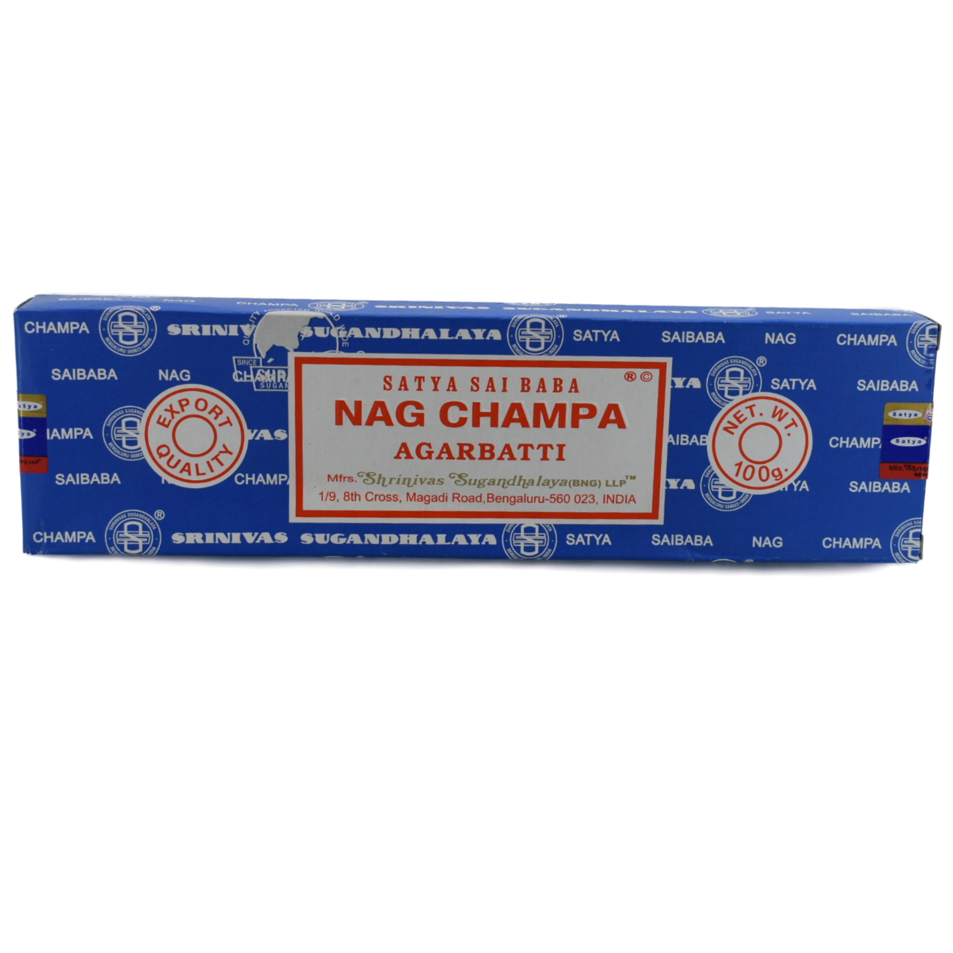 Nag Champa 100gr Incense Sticks.  A dark blue box with a white rectangle in the middle. The red lettering and frame just inside the border. The lettering has the company name and title; Satya Sai Baba, Nag Champa, Agarbatti. Below the title is the manufacturer&