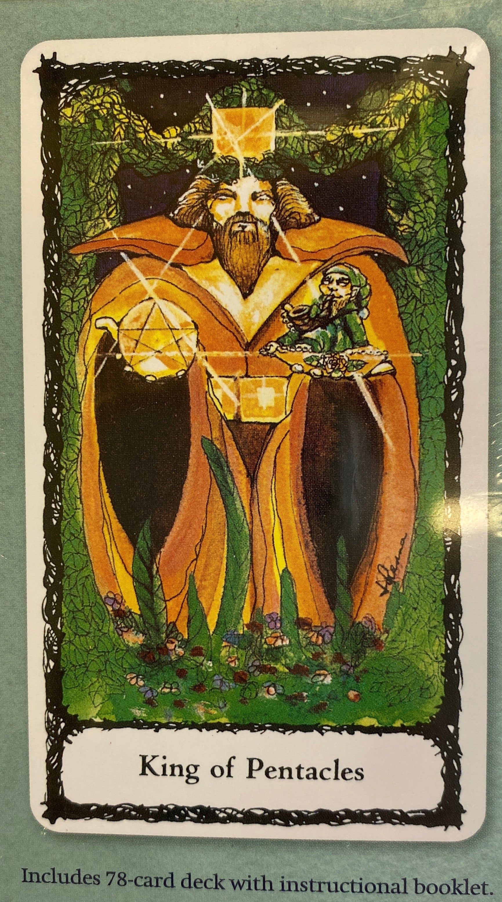 Back of box green with image of a card on back king of pentacles 