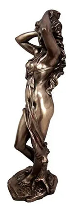 Bronze statue of a nude figure on a white background