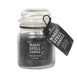 Glass jar with a black spell candle labeled 'Magic Spell Candle Protection' on a white background